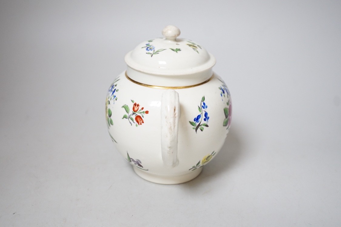 An 18th century Caughley teapot and cover with back to back roses, 15cms high including cover